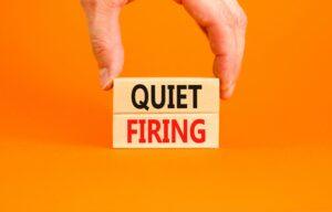 Two blocks on an orange background that, together, say “quiet firing.”