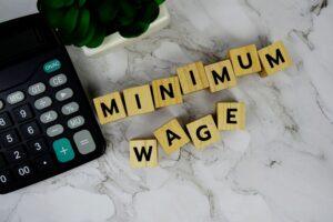 Blocks spelling out ‘minimum wage.’ A lawyer can explain California’s minimum wage laws in 2026.